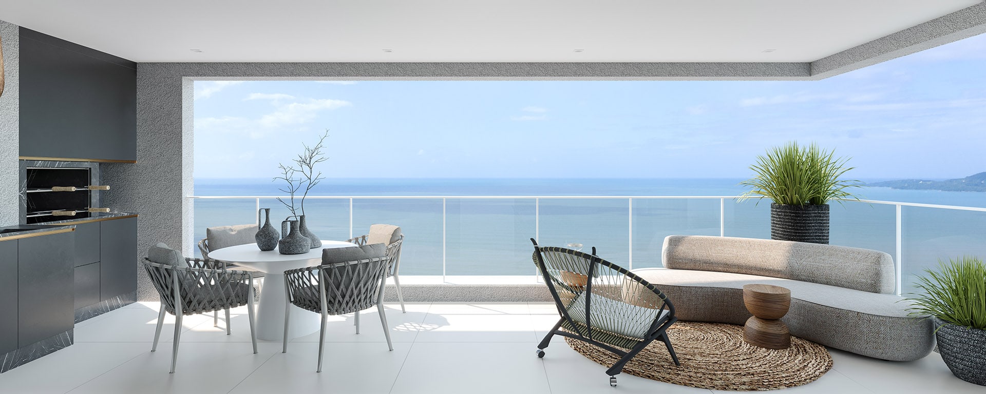 Sacada de apartamento do L'Atelier Concept Homes, com área gourmet e vista para o mar